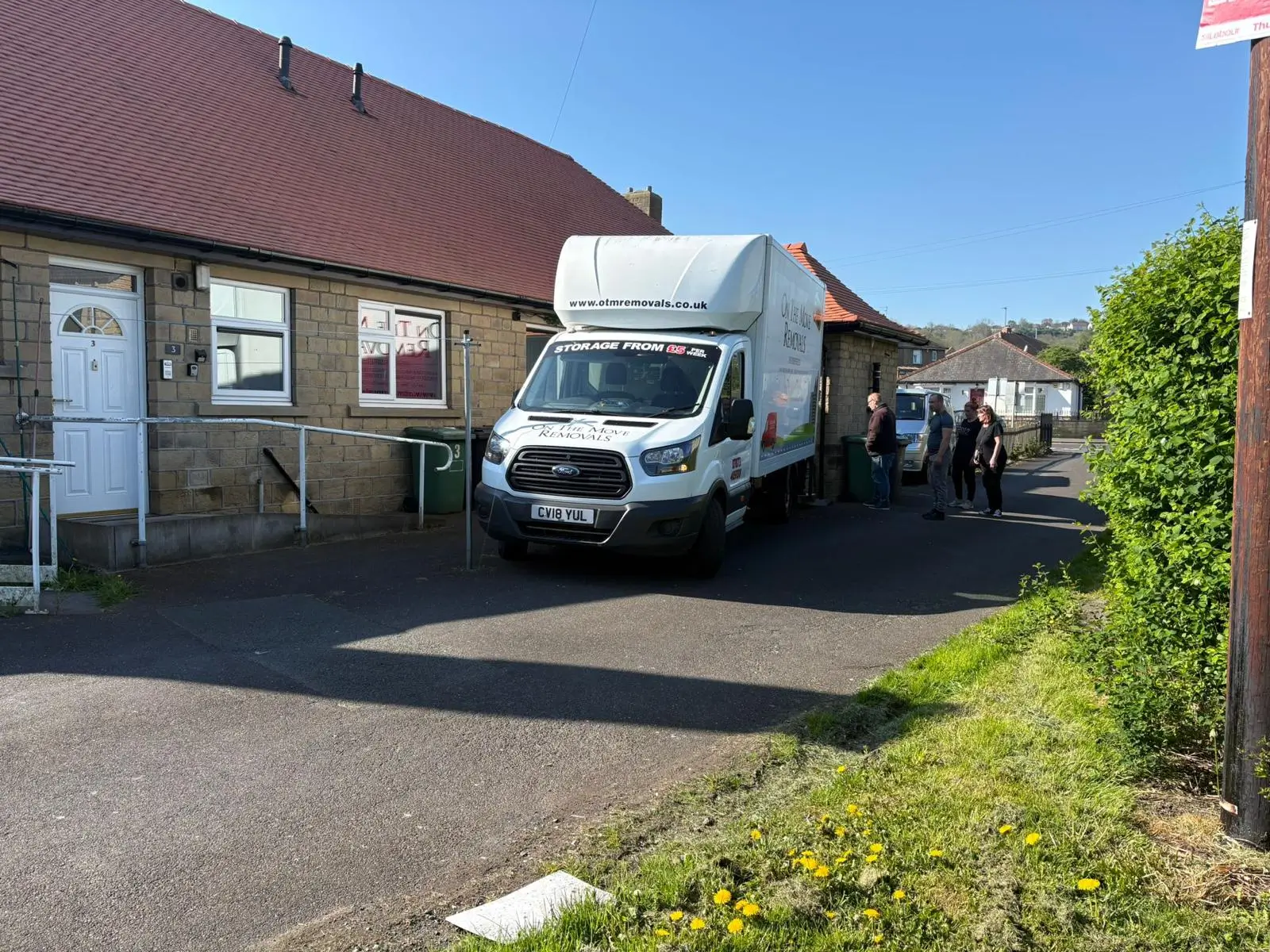 On The Move Removals van outside a bungalow during a house move in Slaithwaite