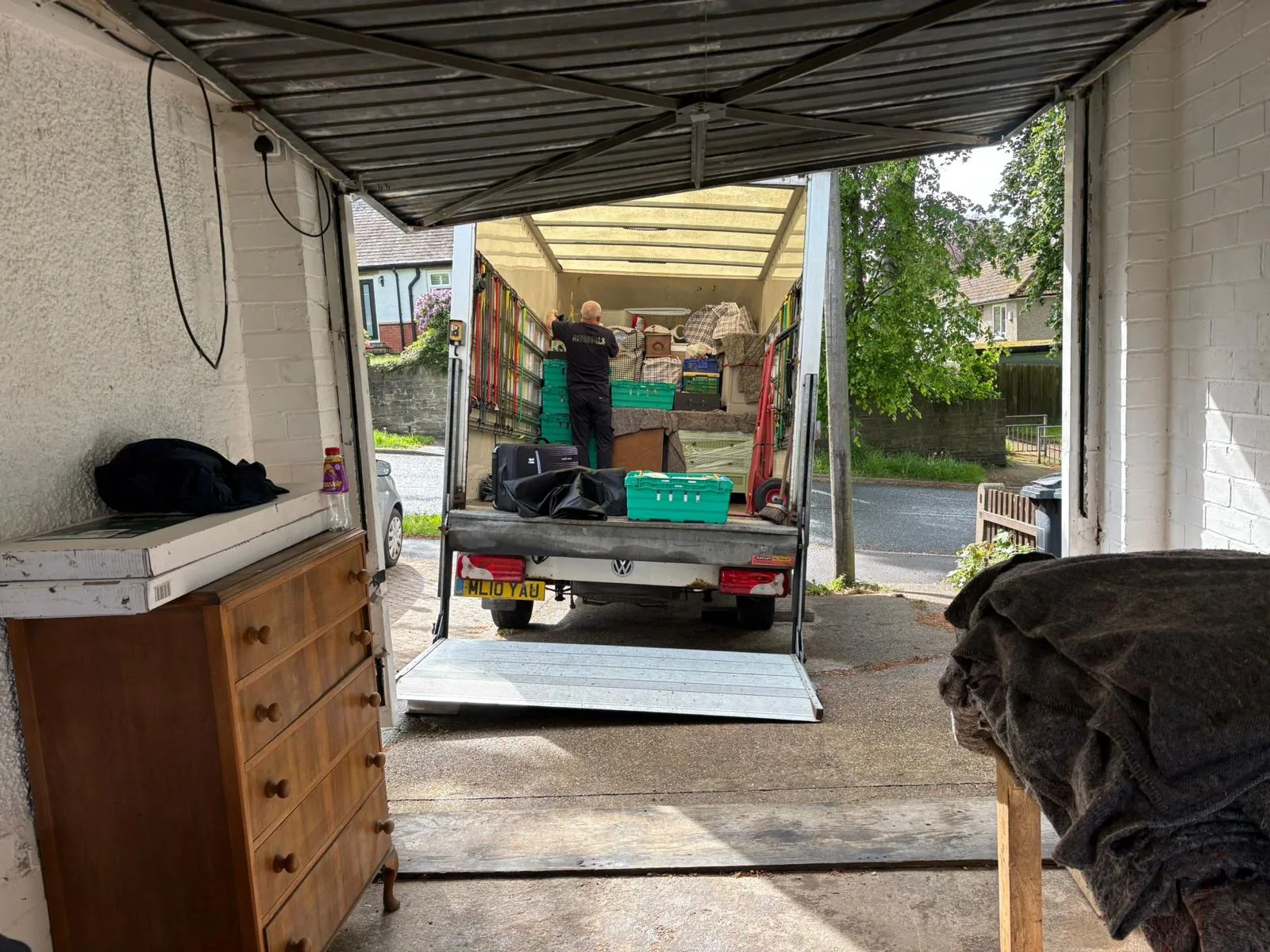 On The Move Removals loading a Luton van from a garage in Birkby, Huddersfield