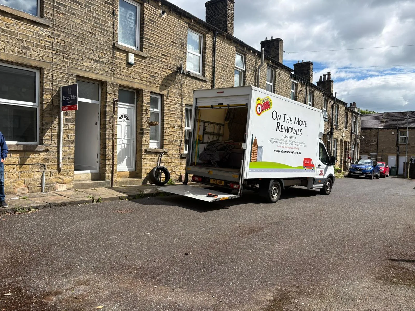 On The Move Removals loading ramp outside a stone terrace property in Marsh, Huddersfield