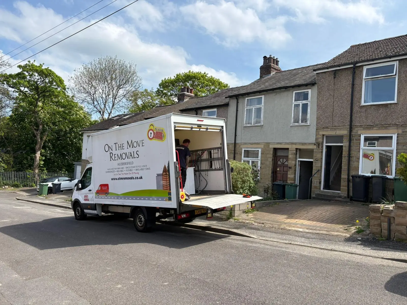 On The Move Removals van loading at a terraced house during a removal job in Lindley