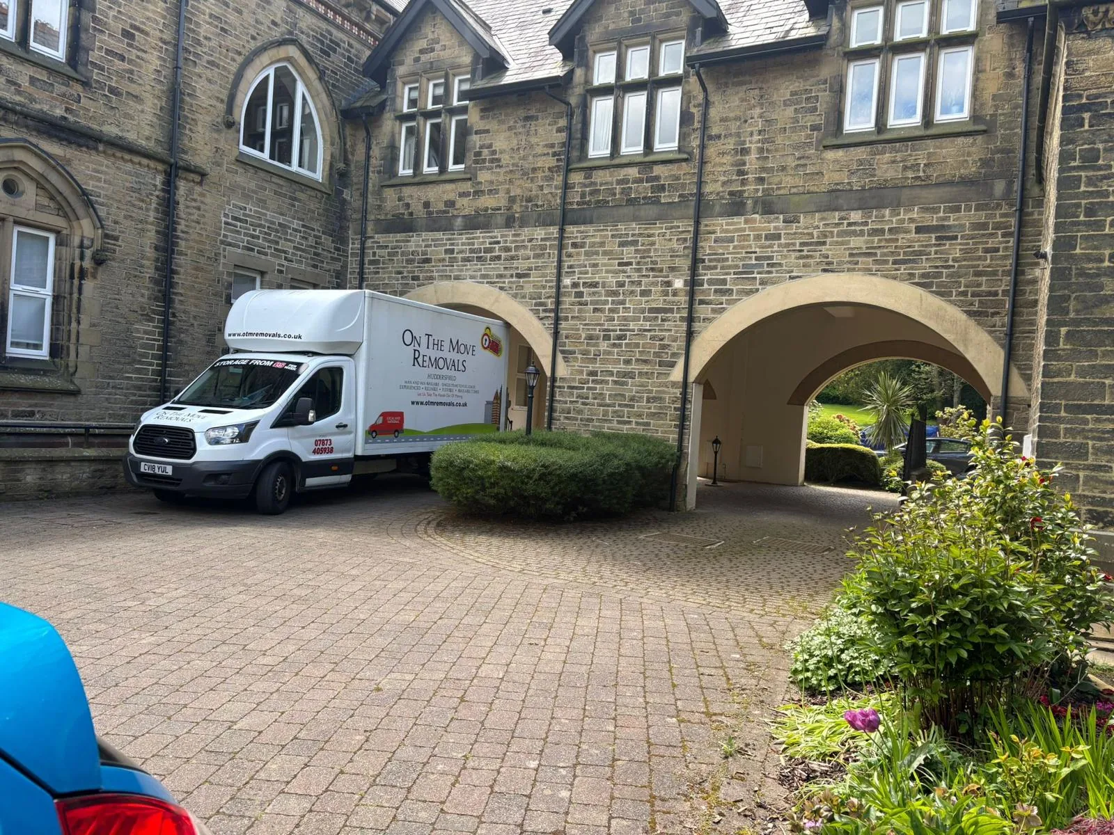 On The Move Removals Luton van on a driveway during a house move in Meltham, Huddersfield