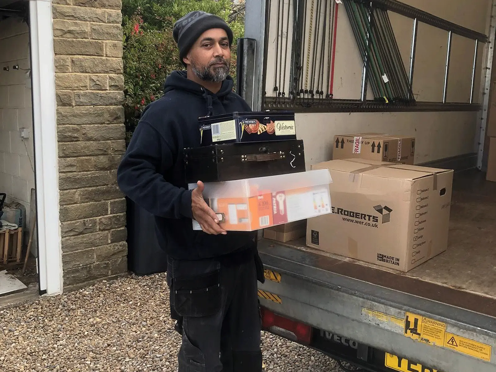 Packed moving boxes stacked and labelled, ready for collection by On The Move Removals