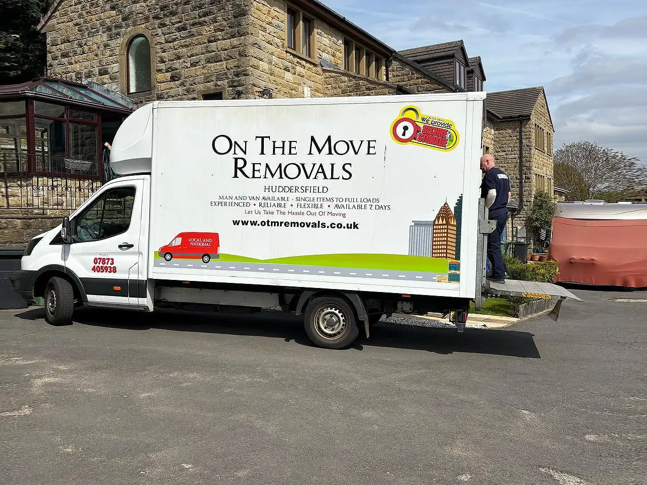 Shaun from On The Move Removals loading a van in Huddersfield ahead of a long-distance move