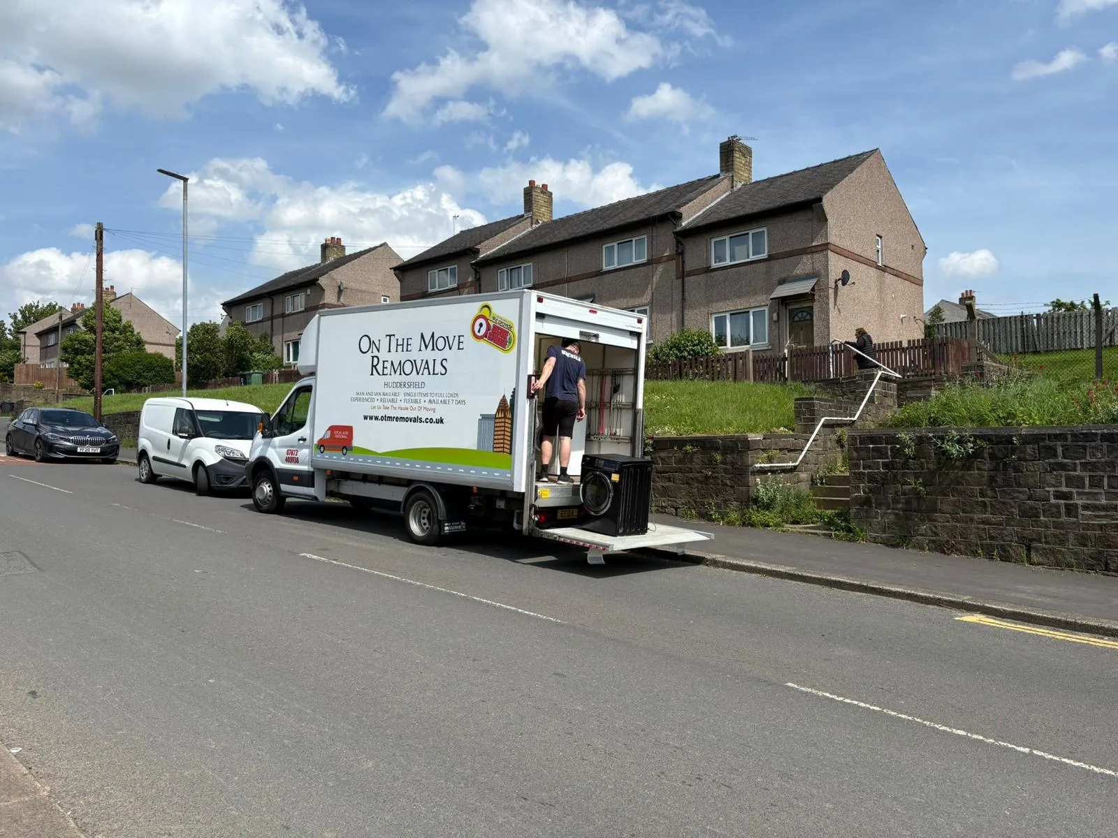 On The Move Removals using a tail lift while loading a house move in Fenay Bridge, Huddersfield