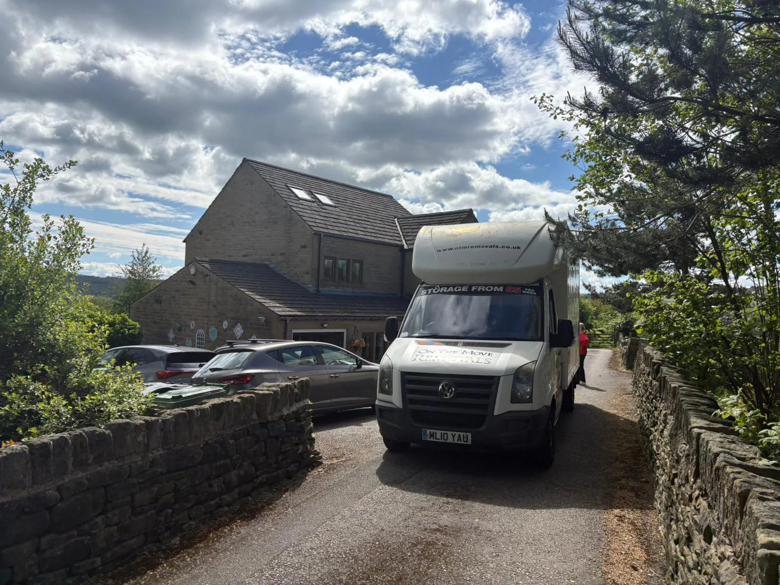 On The Move Removals van parked on a narrow stone driveway in Honley near Huddersfield