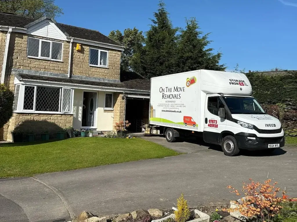 OTM Removals vans outside a customer's home in West Yorkshire