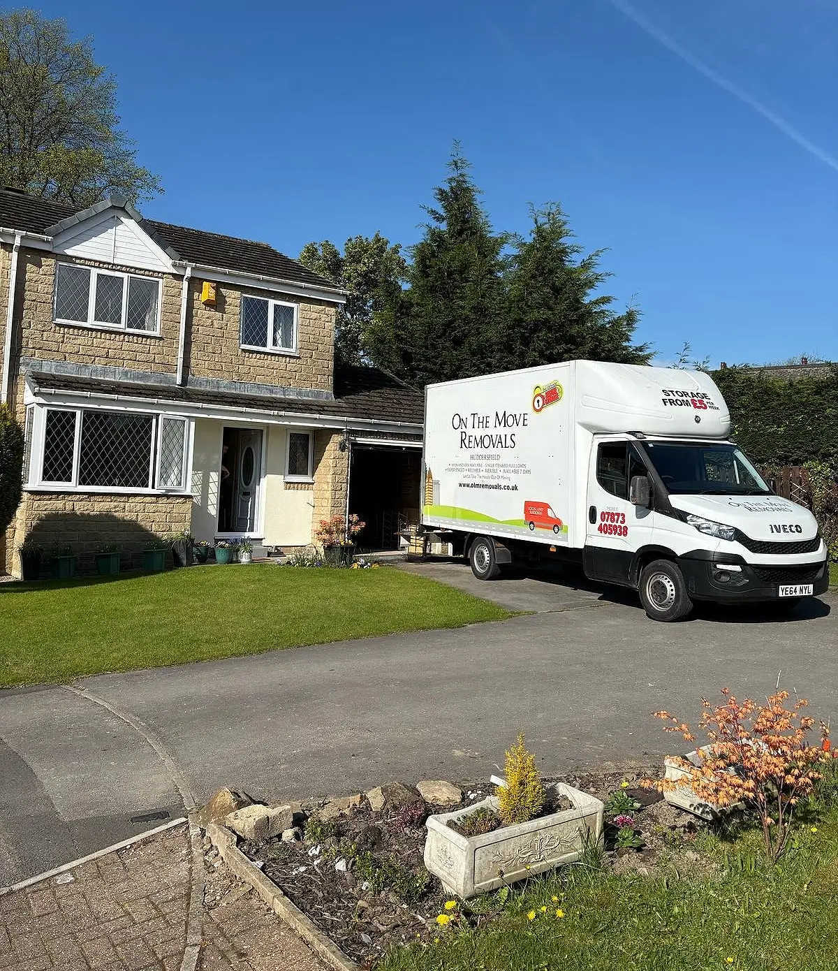 OTM Removals vans outside a customer's home in West Yorkshire