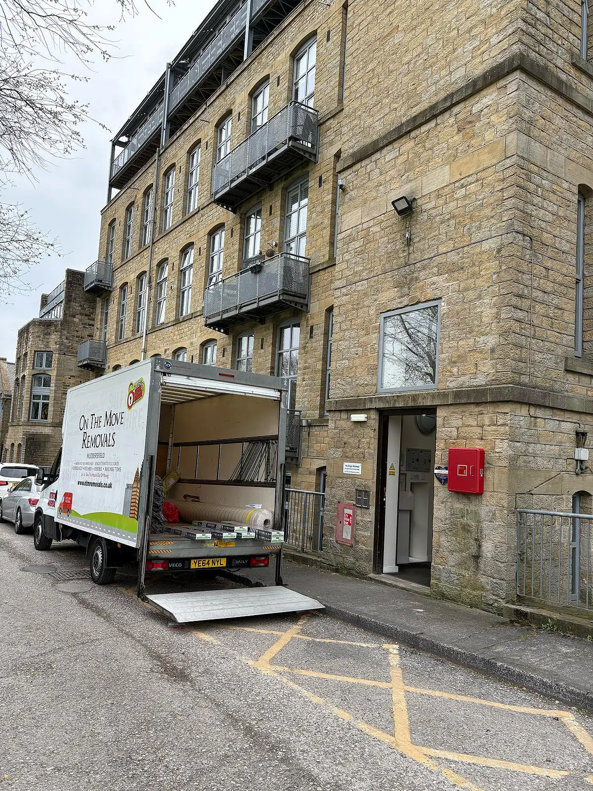Removal van at block of flats